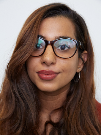 woman with freckles and glasses