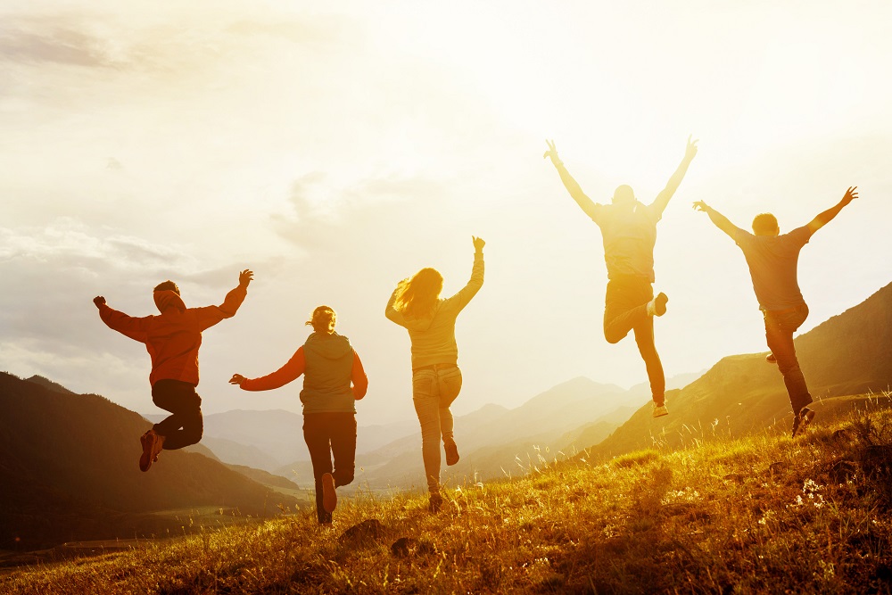 Group of friends happy and jumping in the air as they have quit smoking