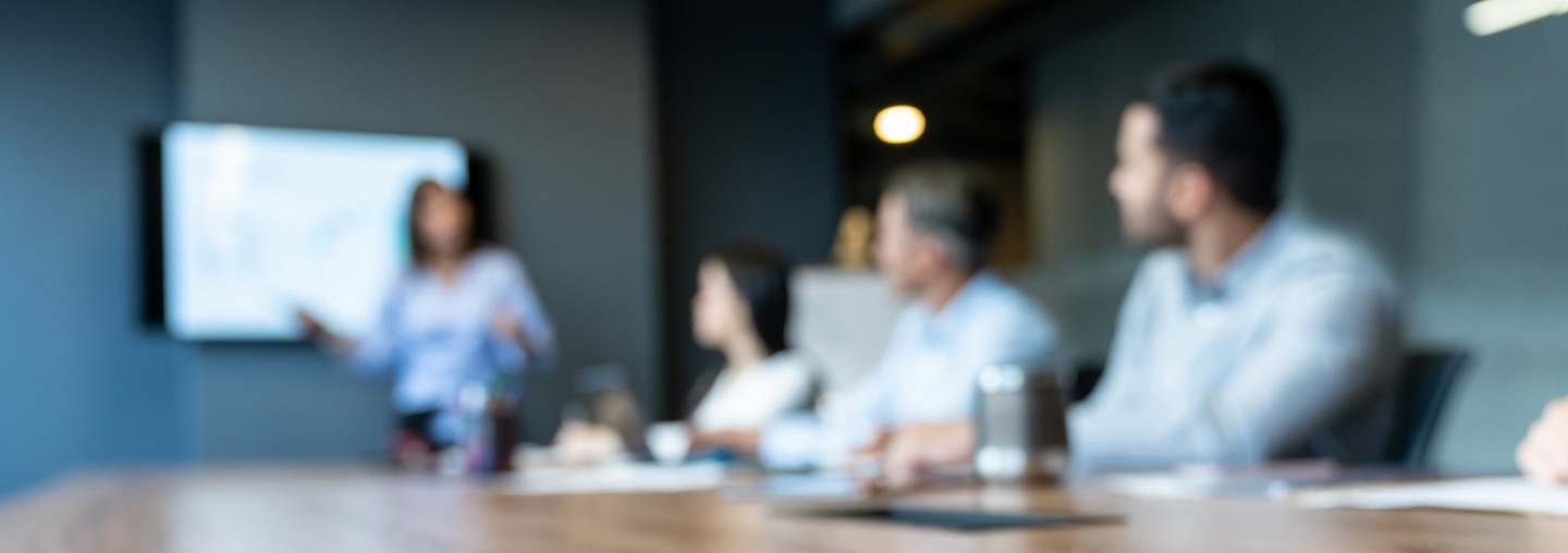 Group of business people in a meeting at the office - blurred concepts