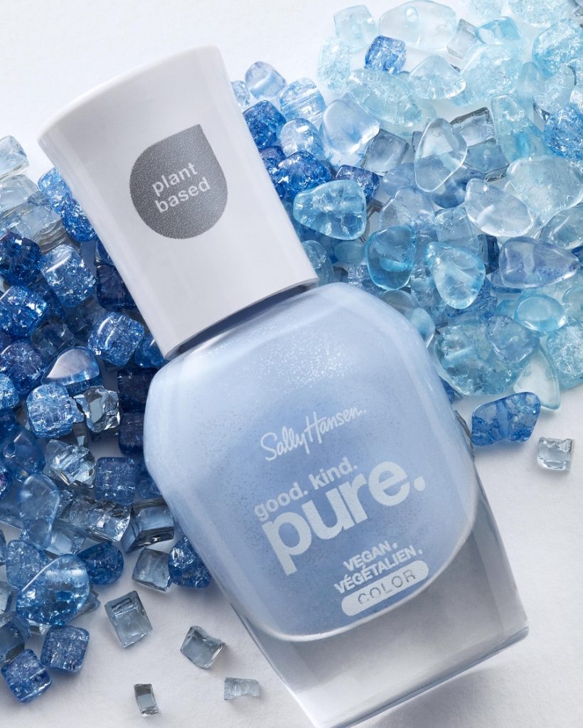 Blue nail varnish on a bed of blue crystals 