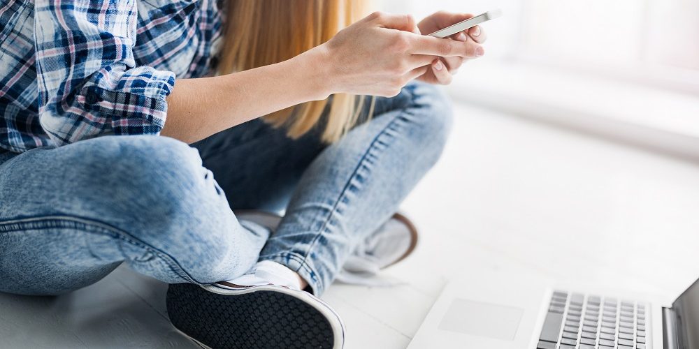 Young woman using smart phone