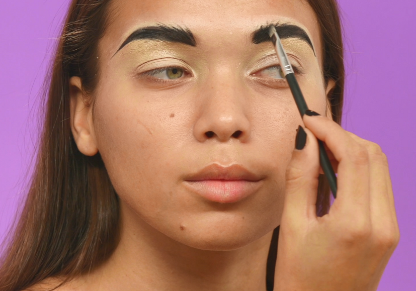 Model applying brow pomade