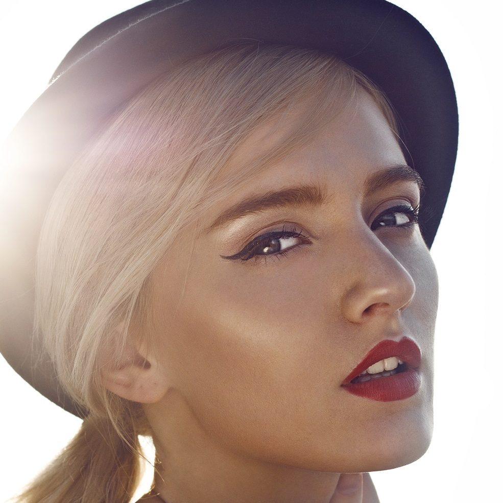 Portrait of beautiful young woman on the rooftop.
