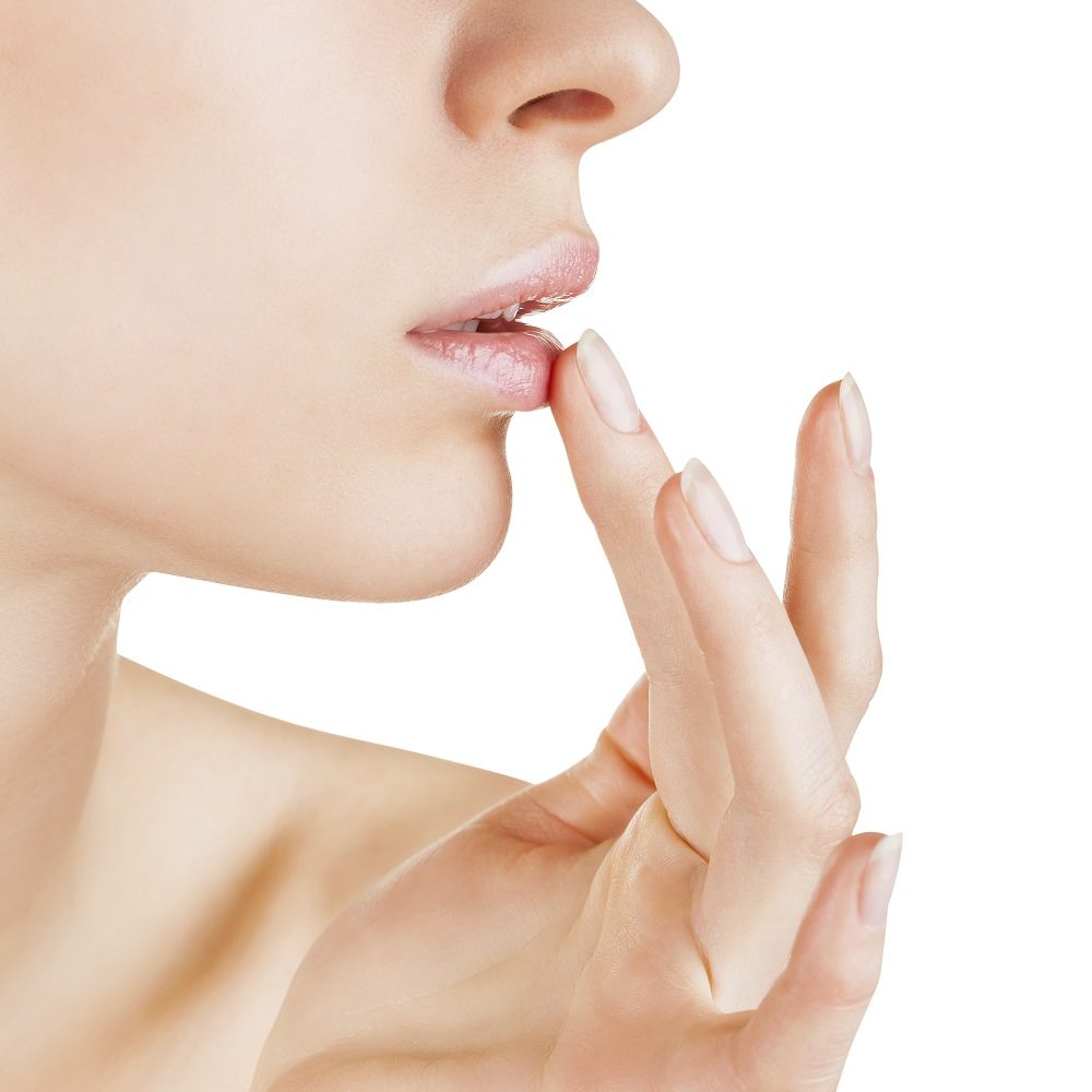 Girl applying lip balm