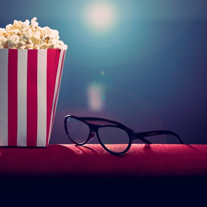 pop corn and 3d glasses on armchair cinema