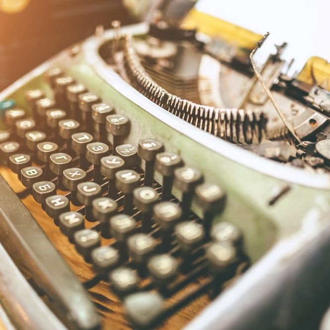 close up picture of an antique typewriter with cyrilic letters